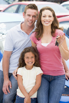 Young Family Collecting New Car