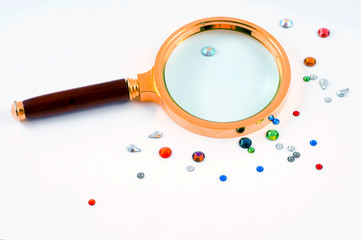 Crystals and magnifier. Isolation on white