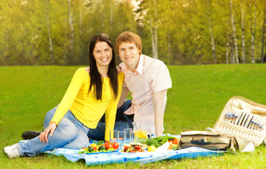 Young couple at romantic picnic