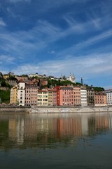 Fototapeta na wymiar Buildings reflected by the Saone river, Lyon, France