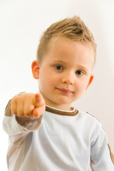 Child showing on somebody by his finger