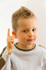 Child pointing something by his finger