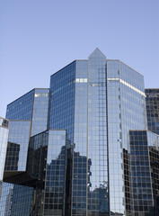 Fototapeta na wymiar Blue Glass Reflective Financial Center