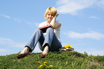 female student outdoor on green grass