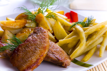 Delicious rissole with potatoes and salad