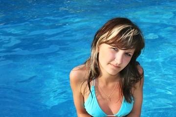 Yoing woman in water pool