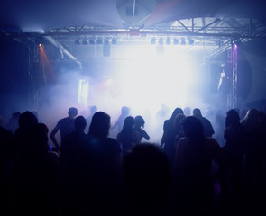 Dancing people in an underground club