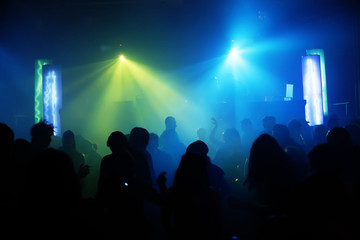 Dancing people in an underground club