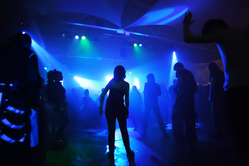 Dancing people in an underground club