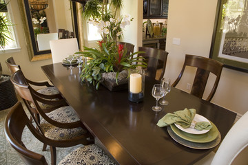 Luxury home dining table with modern tableware.