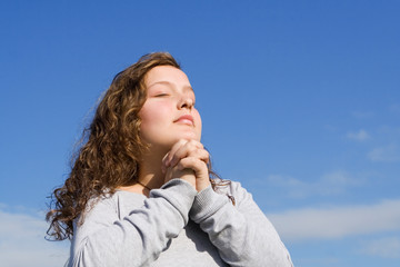 christian child praying hands clasped in prayer © godfer
