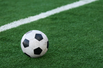 Fototapeta na wymiar Football on a grass of stadium
