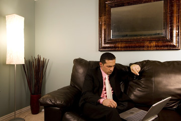 Home or Office - Businessman Working on the Couch