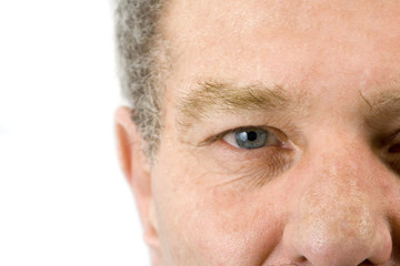 Close up on the face of a baby boomer - Isolated