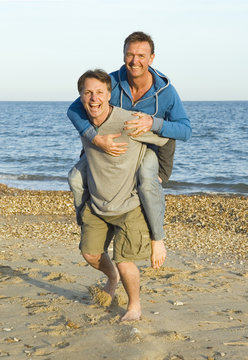A happy smiling gay couple fooling around.