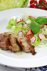 Pork steak with vegetable salad