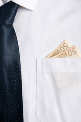 Euro banknotes in a businessman's pocket