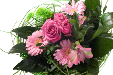 Beautiful flower bouquet with roses, gerbera and green leaves
