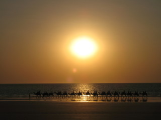 Sunset over the camel train, Cable Beach, Broome, Australia