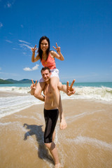 Fototapeta premium couple playful by the beach
