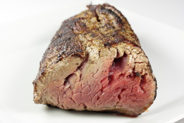 a grilled filet on a white plate