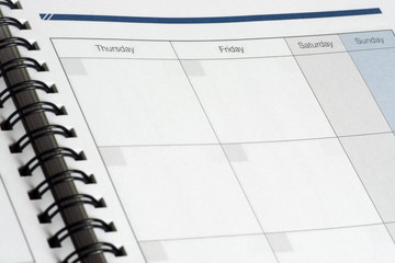 Closeup of the days of a calendar with the focus on Friday