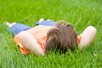 Boy Laying in Grass Relaxing
