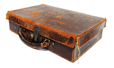 Battered old brown leather suitcase against a white background