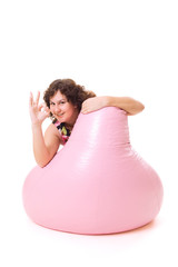 Pretty heavy woman showing ok sign and smiling
