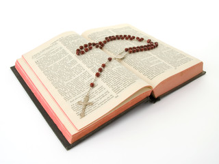Rosary over an old holy bible
