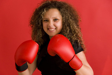 beautiful female boxer on red