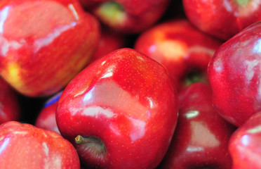 Apples in a fruit and vegetable market display.