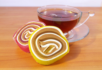 Colorful fruit candy and tea