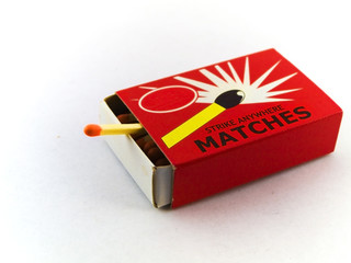 Matches in matchbox on white background