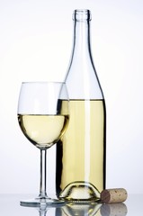 Bottle and glass of white wine with cork
