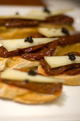 Typical Pintxo or Tapa (Dry Tomato with truffle) from Spain