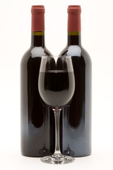 red wine bottles with filled wineglass