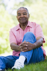 Naklejka na ściany i meble Senior man relaxing in park