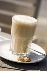 latte macchiato on coffeehouse table outside