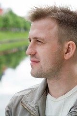 Obraz premium smiling man half face