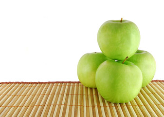 Green apples on the table-cloth