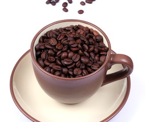 Cup full of coffee beans from above