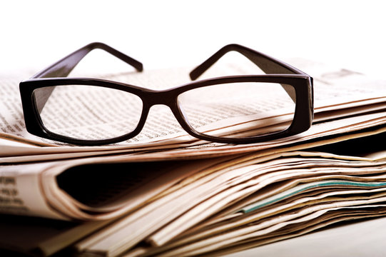 Reading Glasses on Newspapers