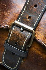old worn leather bag buckle detail
