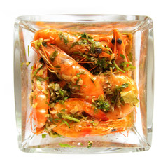 Shrimps in glass dish isolated on white background