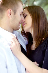 An attractive couple sharing a passionate kiss