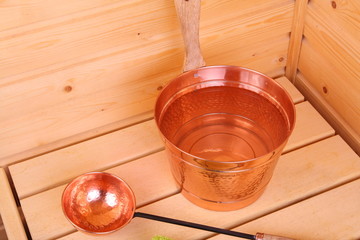 Bucket with water in sauna