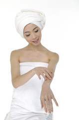  Beautiful woman wearing white towel on her head