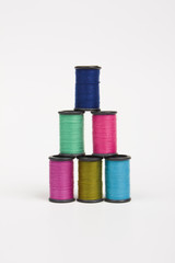 colorful spools of thread in a pyramid shape