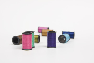 sewing spools on white background
